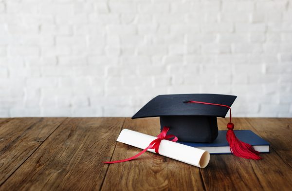 graduation cap and graduation diploma