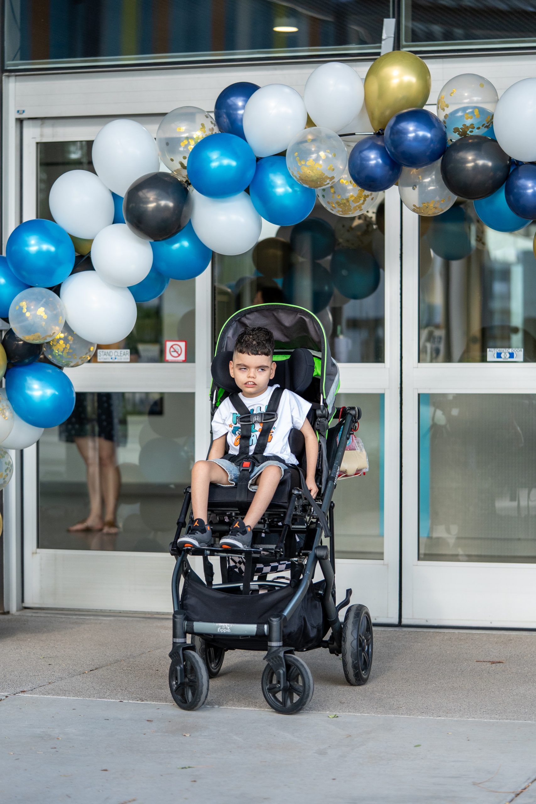A boy poses outside FBC’s main campus.